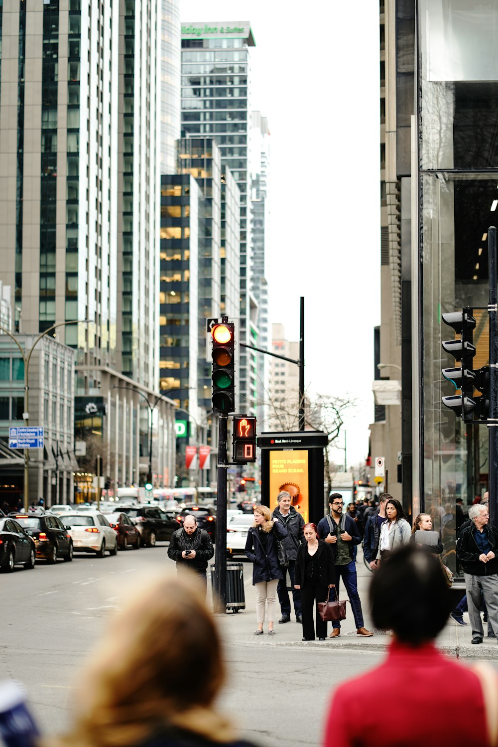 people walking in a side-road during daytime