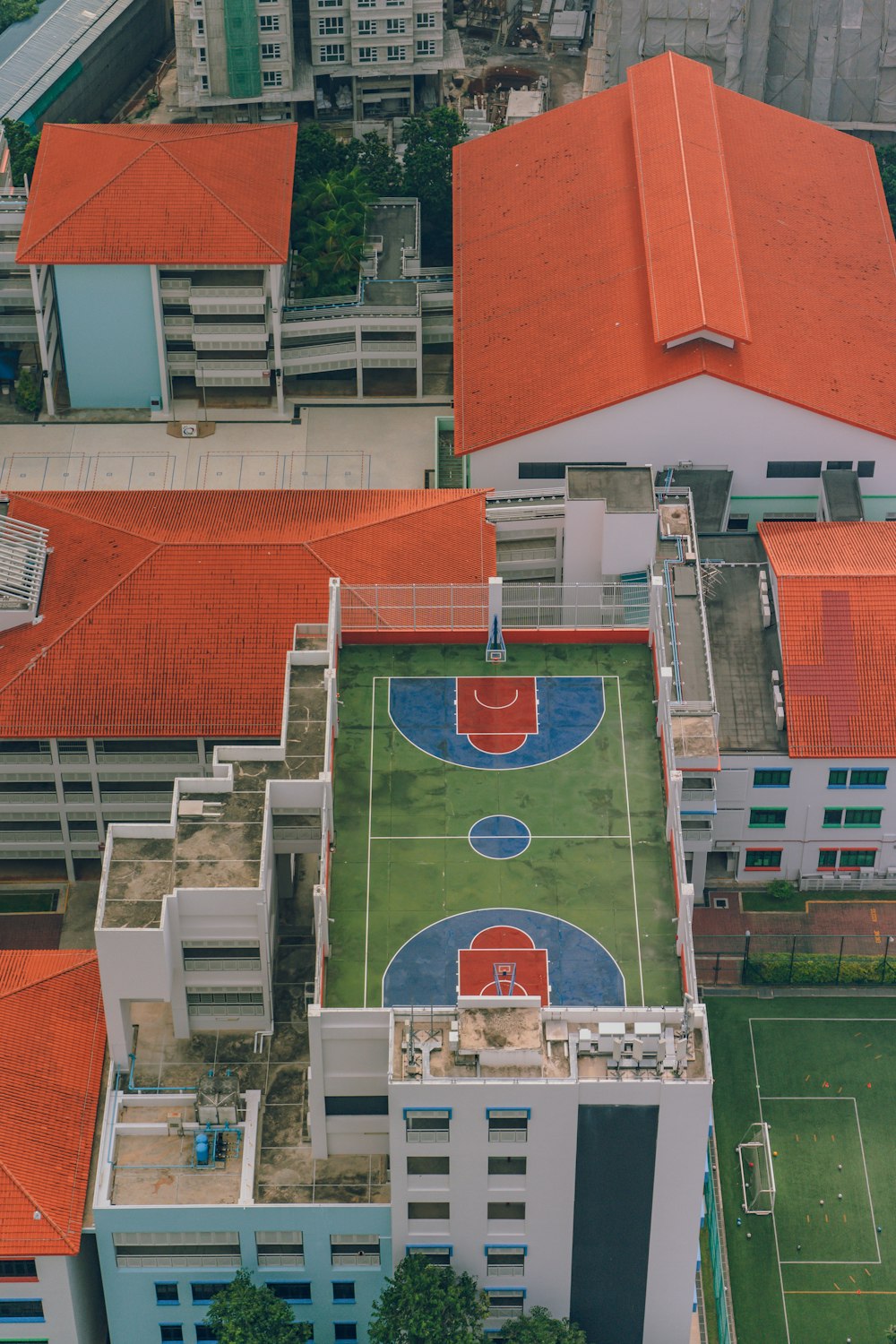 aerial photography of basketball court near houses
