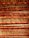 An arrangement of parallel bamboo sticks reinforced with horizontal wooden slats. The bamboo appears aged with natural imperfections, while the wood has a reddish-brown hue, creating an earthy texture.