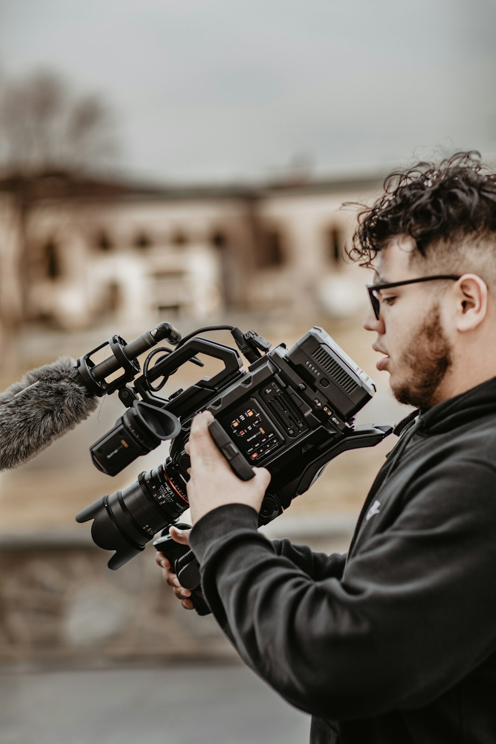 man holding professional camera