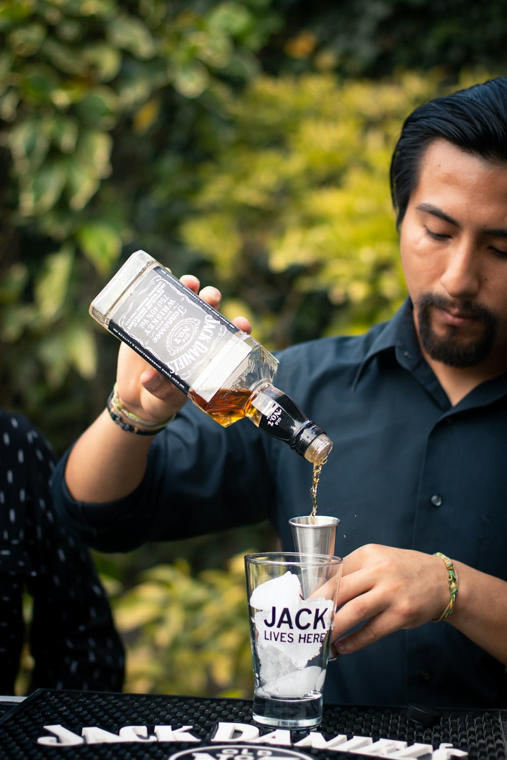 man holding Jack Daniels bottle