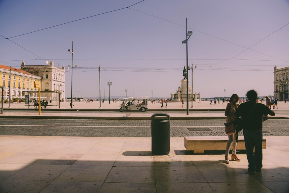 person standing near trashbin