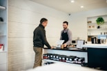 man buying item in shop