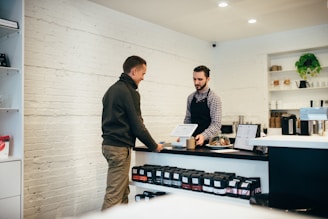 man buying item in shop