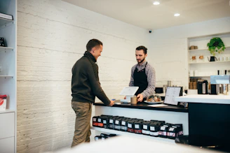 man buying item in shop