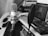 A close-up of a microphone and audio equipment in a cozy recording space.