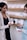 close-up photo of woman standing and holding plastic bottle