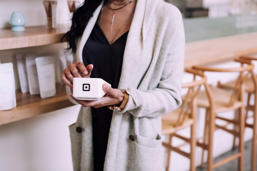 woman using white device