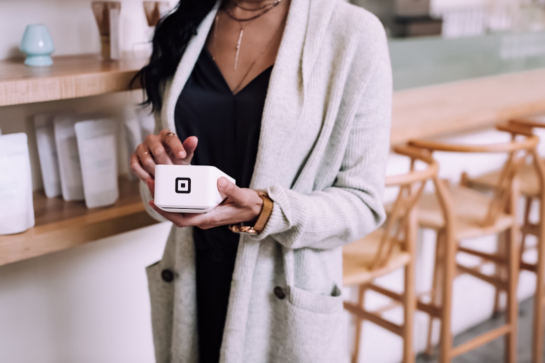 woman using white device,