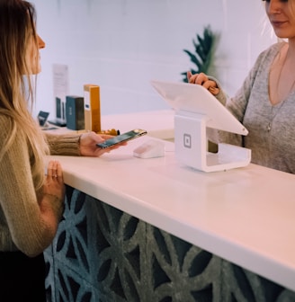 woman standing near monitor