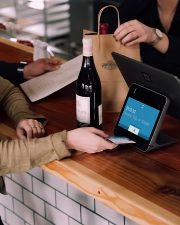 person playing card on POS machine