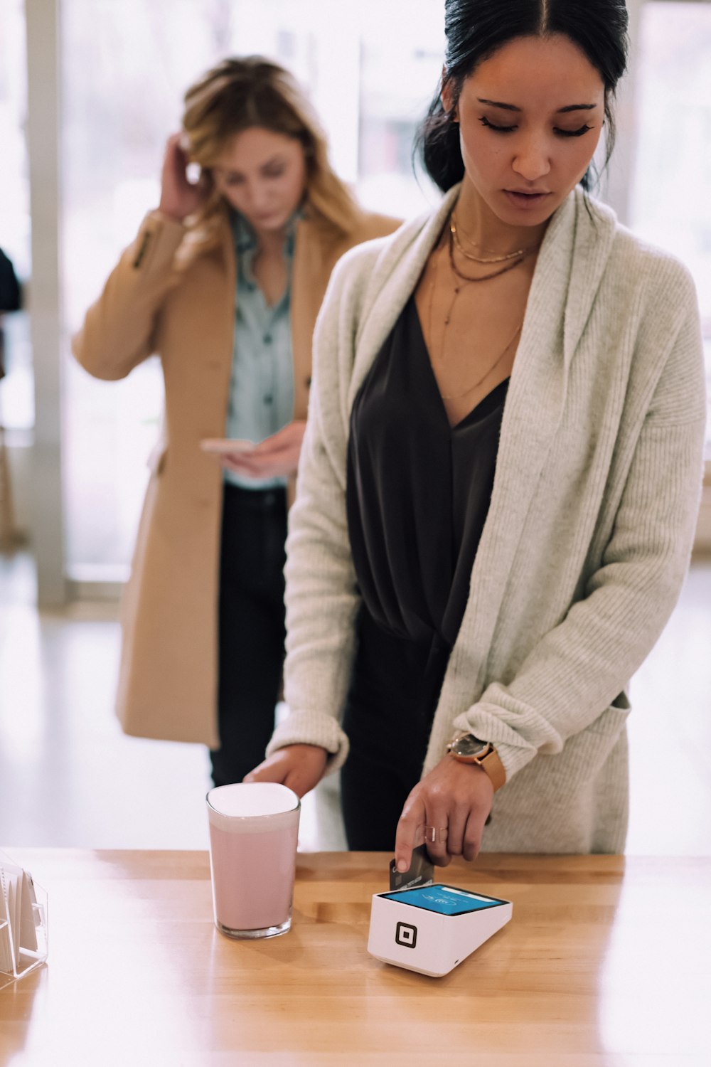 woman using white device