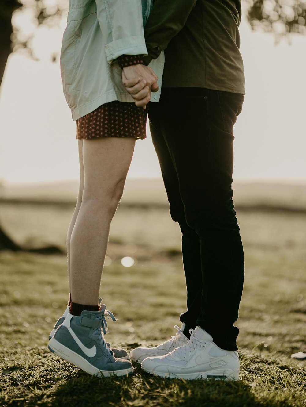 couple holding hands facing each other