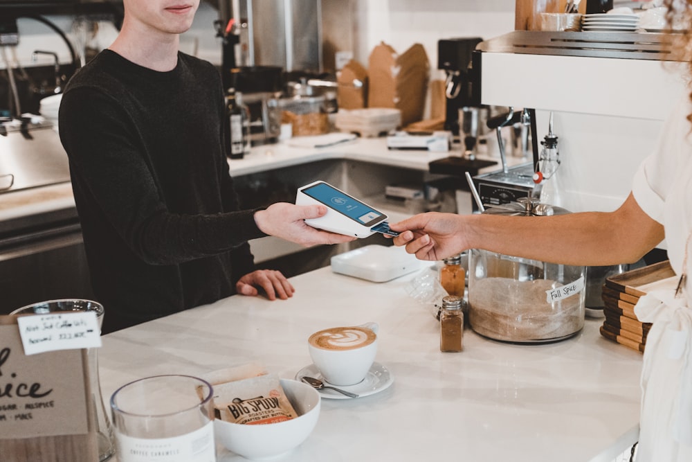 man paying using credit card