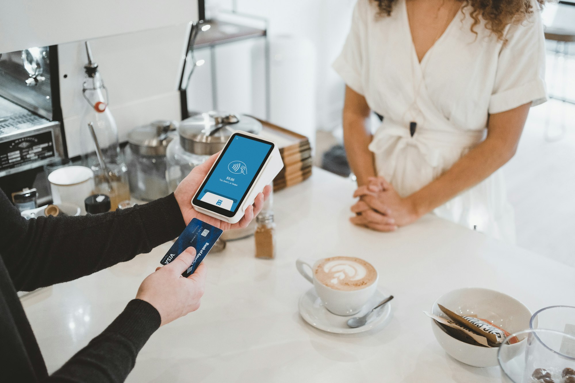 Customer paying for coffee with credit card 