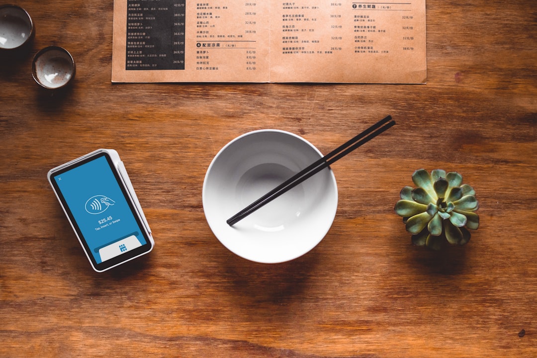 black chopsticks in white ceramic bowl on table