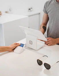 Close-up of a small business owner happily reviewing their payment statement with a paypro advisor.