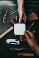 person holding Visa card and white device