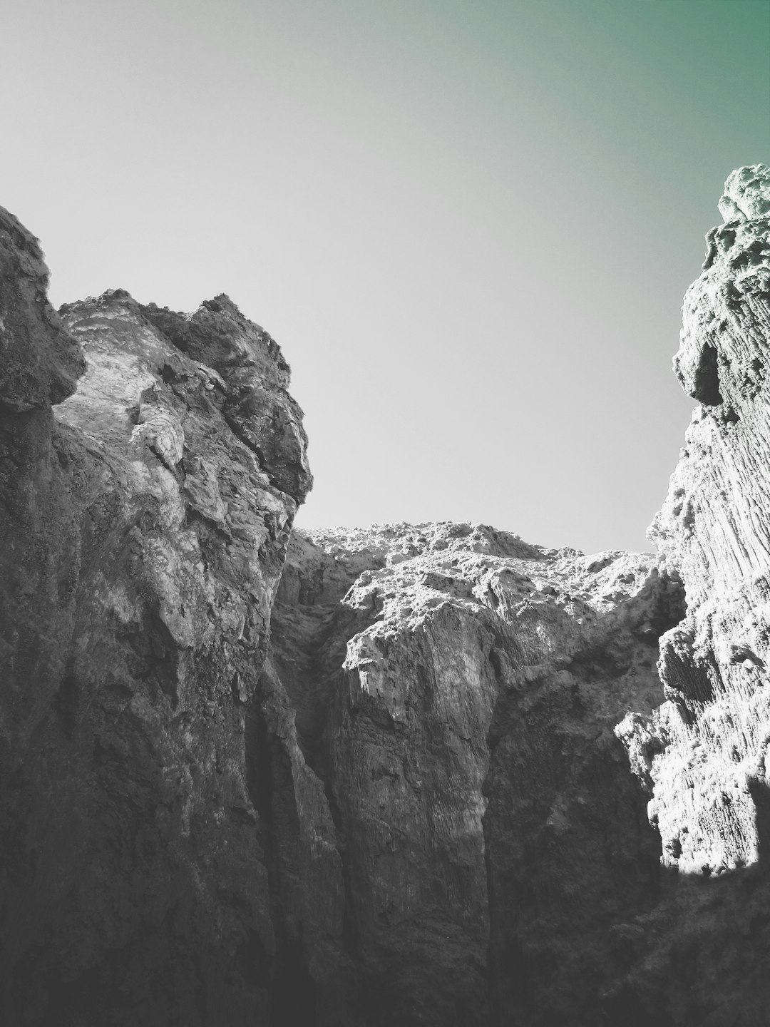 greyscale photography of rock formation