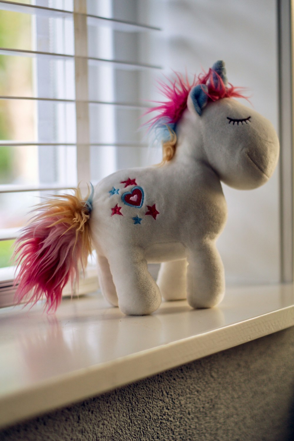 white and pink My Little Pony plush toy