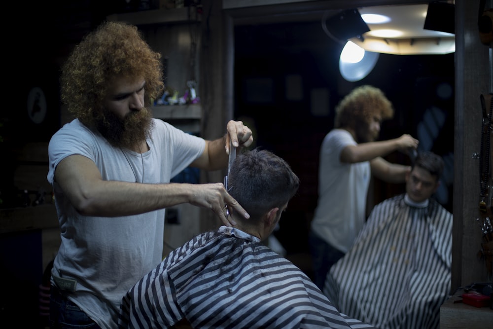 person having hair cut