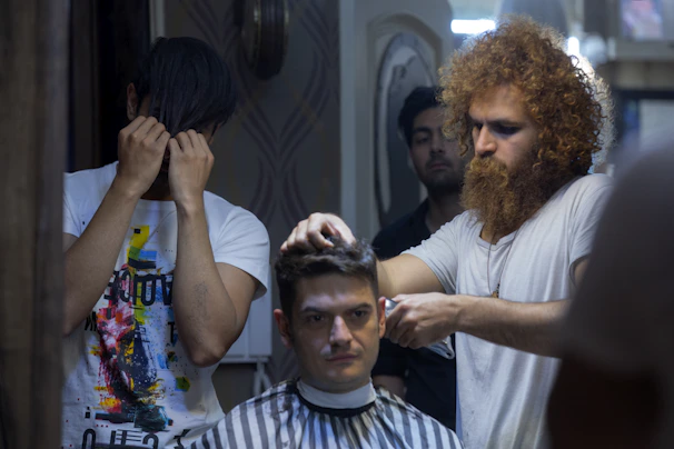 Barber and client sharing a relaxed moment during a home service haircut session