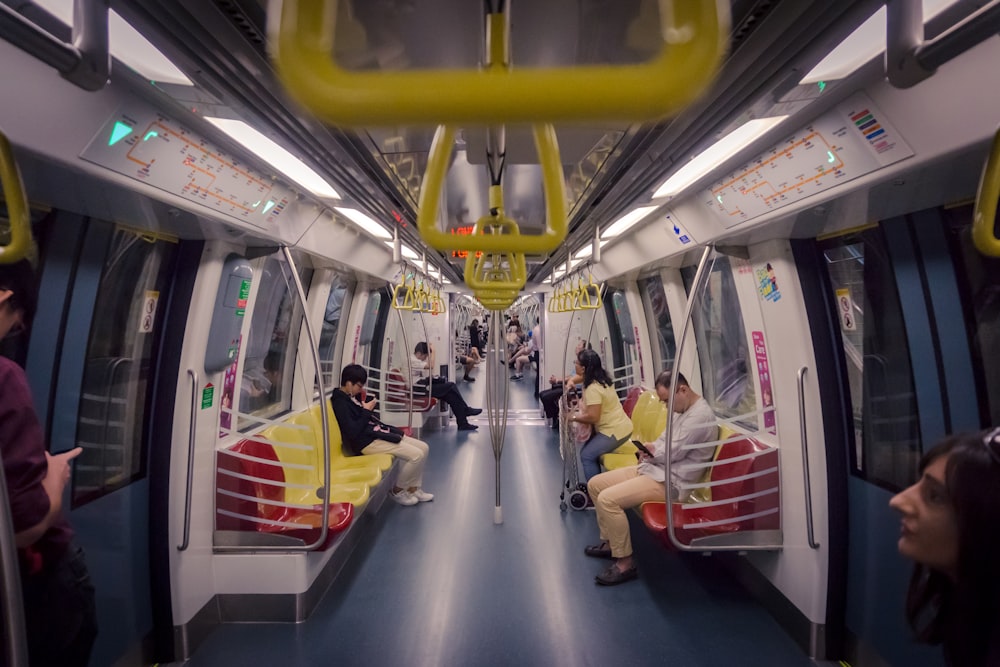 people sitting bench in train