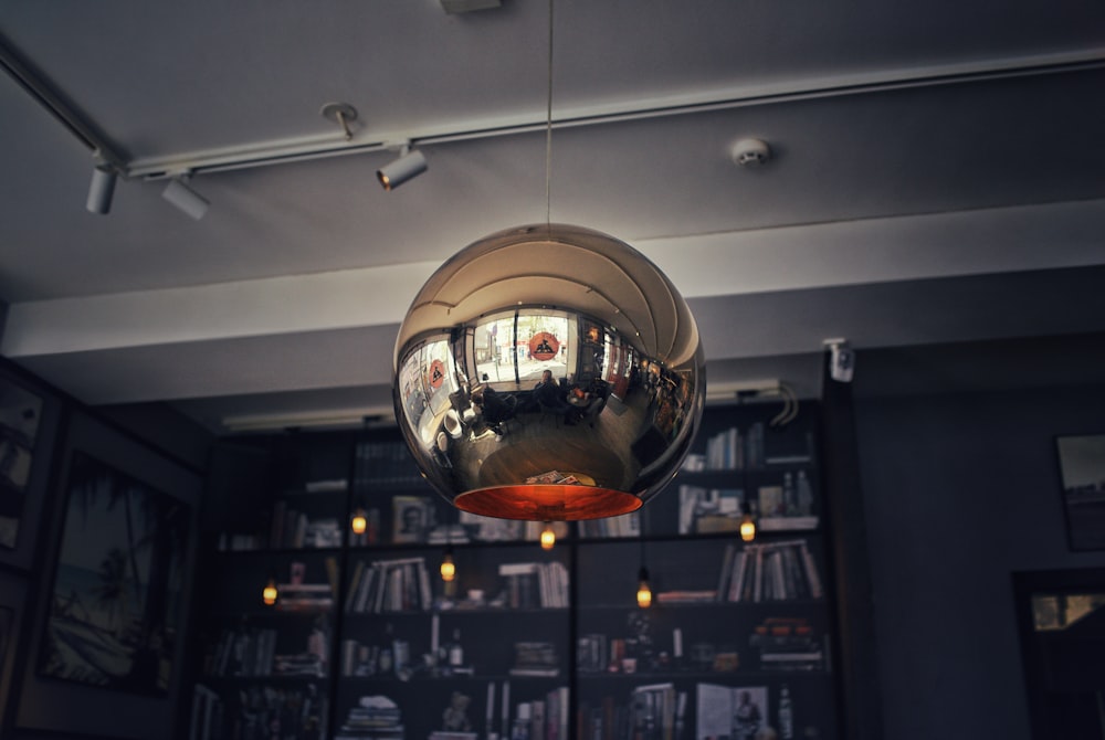 round gray pendant lamp hanged on ceiling