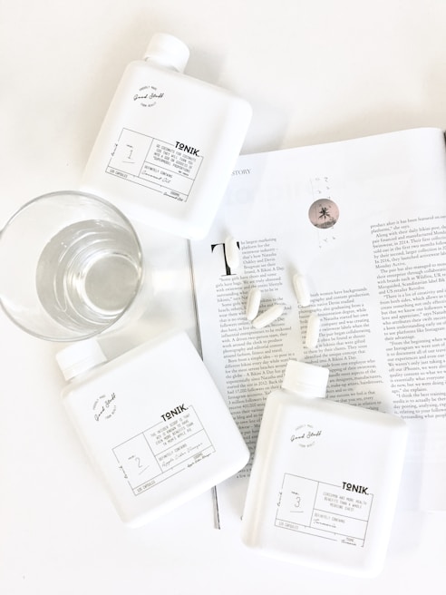 Bright, clean bottles of nulifespan supplements arranged on a minimalist white shelf