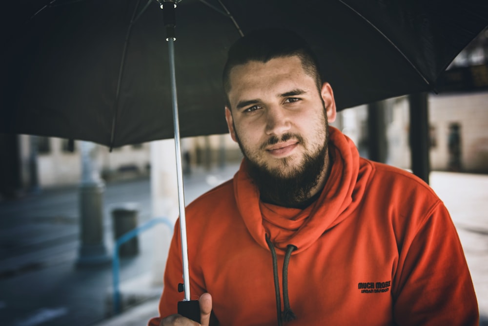 man with black umbrella