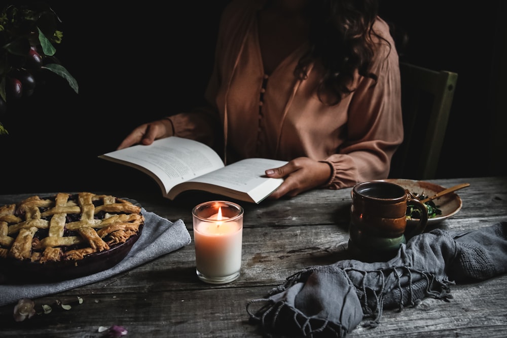 woman holding opened book