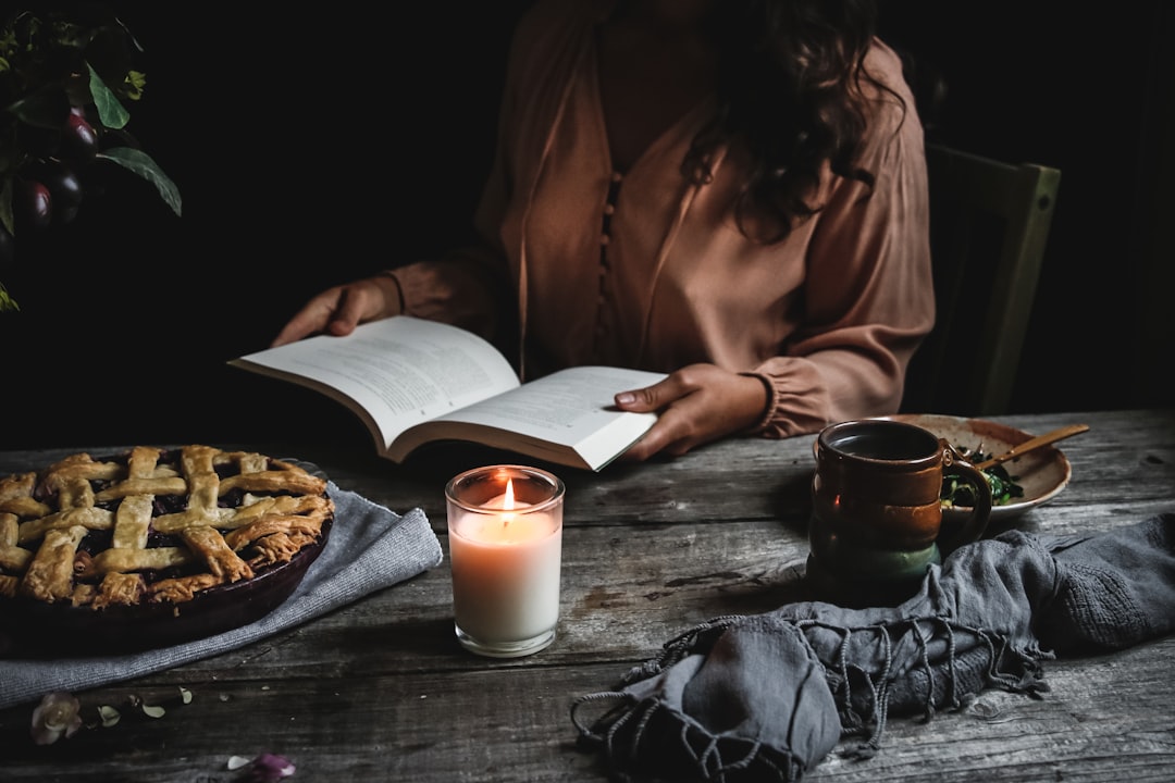woman holding opened book,