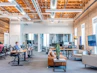 open office space in workplacewith people working and colaborative meeting room
