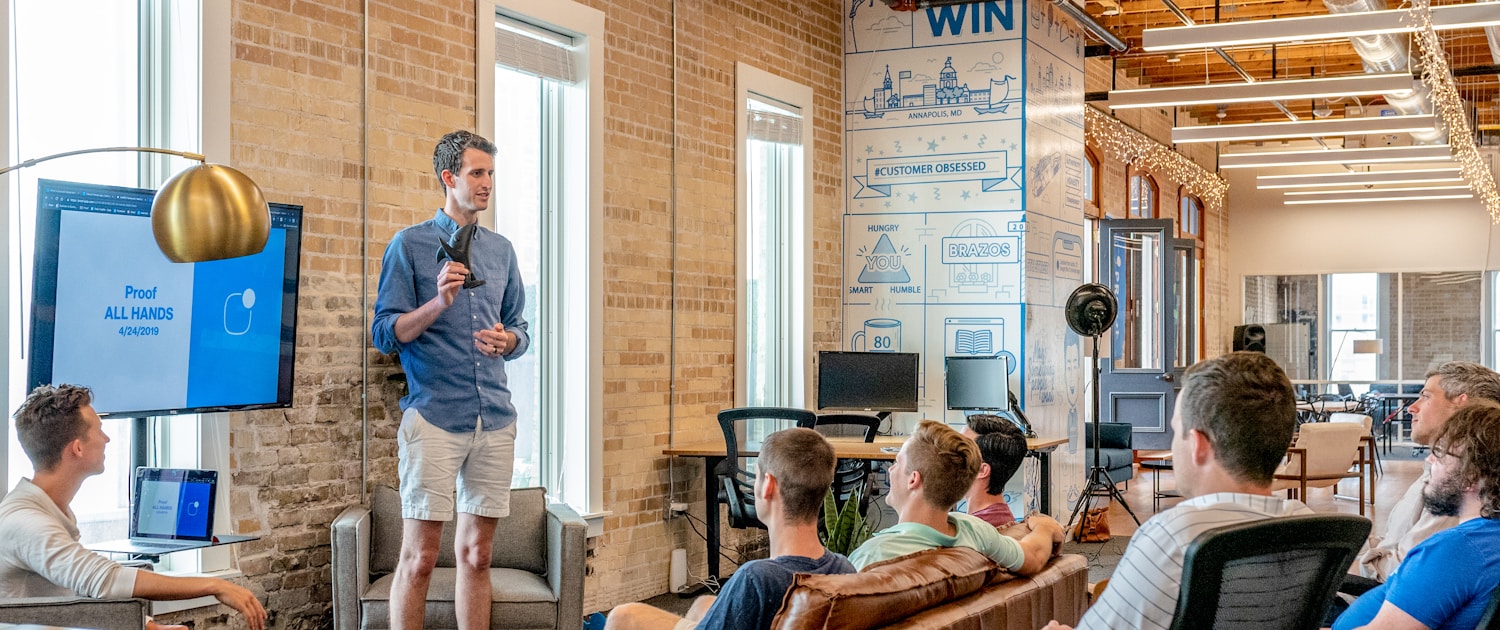 Lean Startup man standing in front of group of men