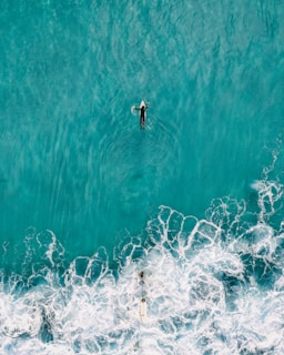 person on white surfboard