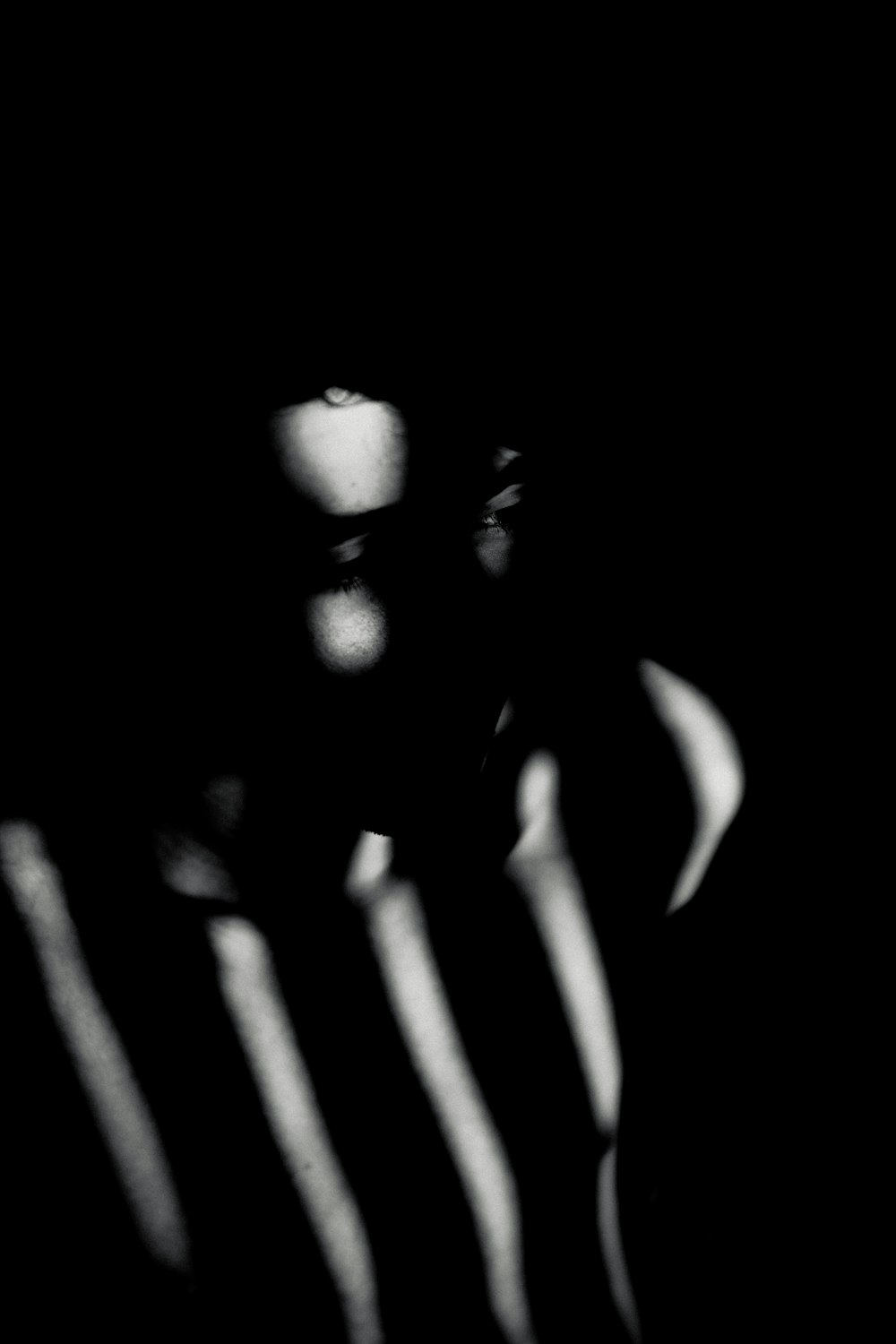 a black and white photo of a person's shadow
