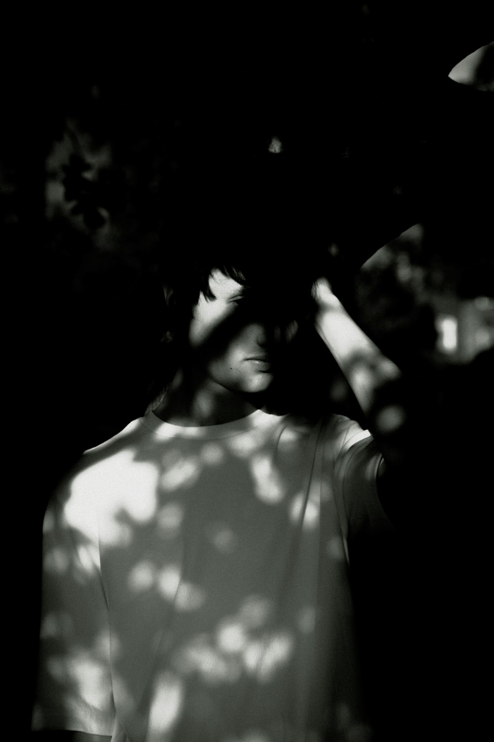 grayscale photo of man in crew-neck shirt