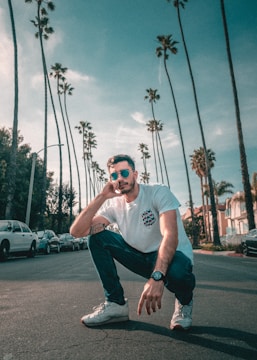 man sitting on road