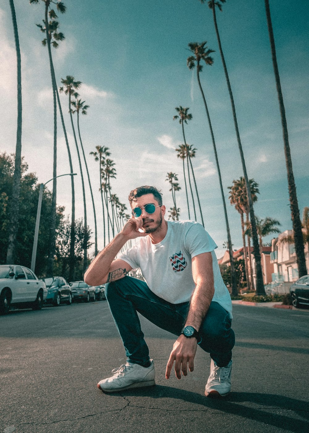 man sitting on road