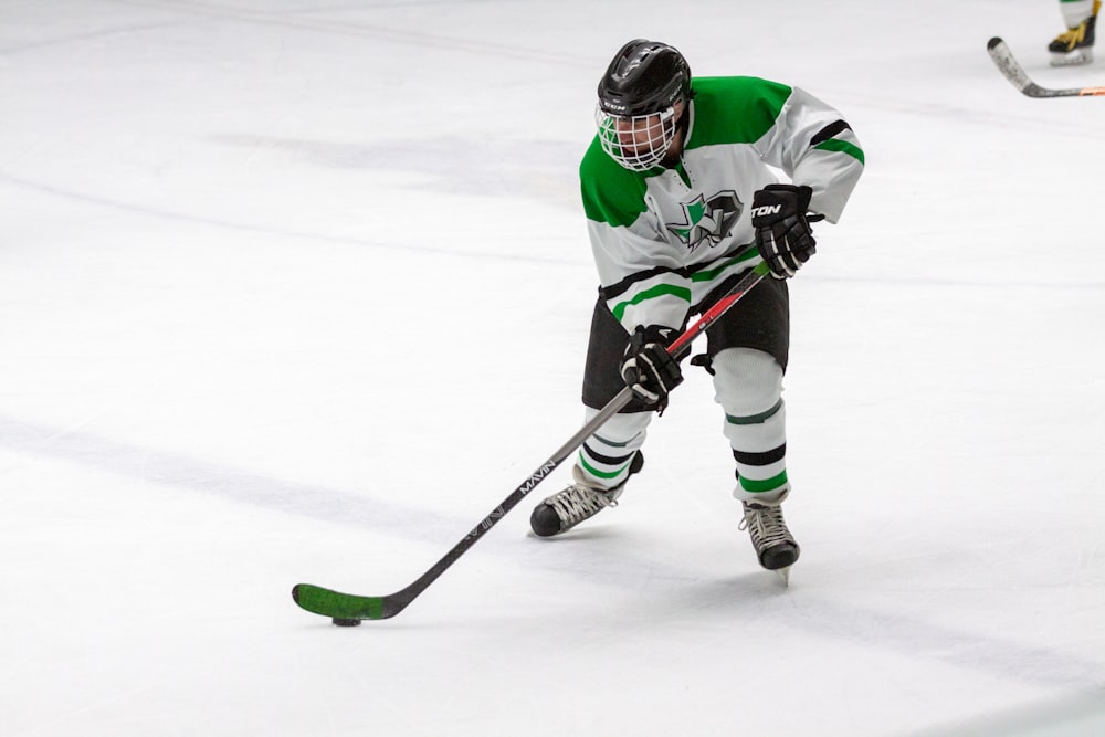 man in yellow and green ice hockey jersey t