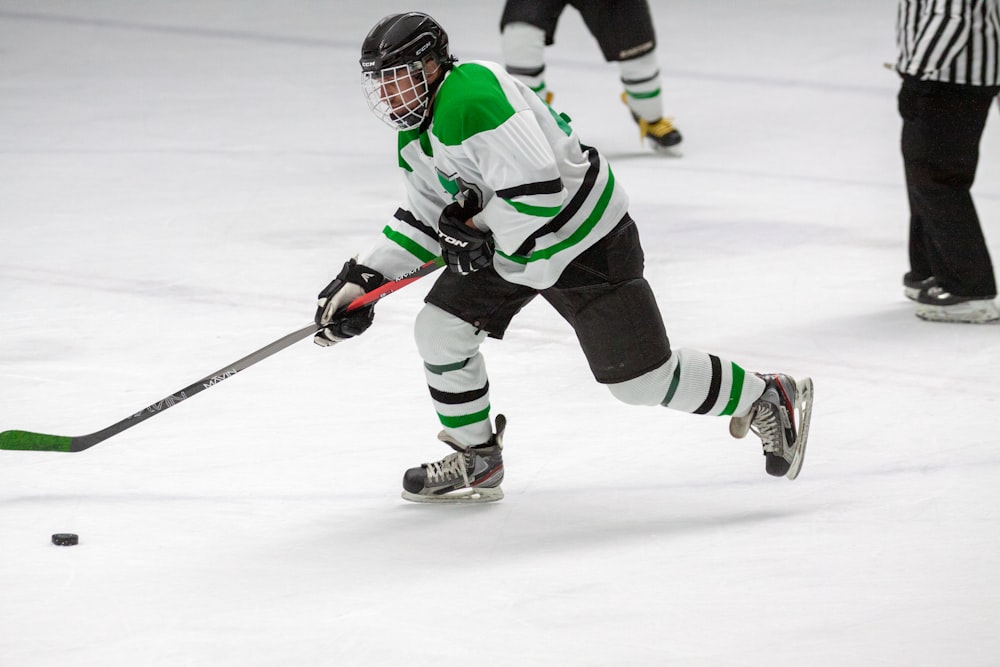 man playing ice hockey