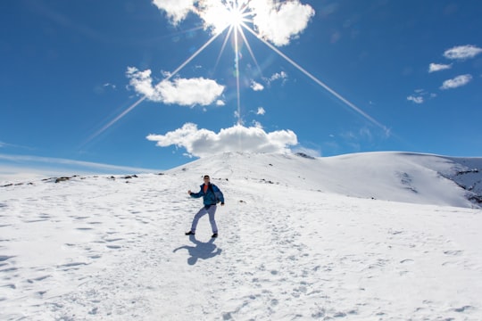 man standing on snowfield during daytime in The Whistlers Summit Trail Canada