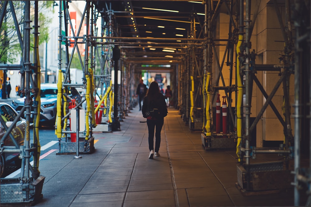 woman walking on sidewalk