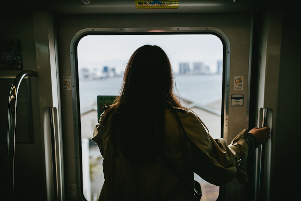 woman in front of train door