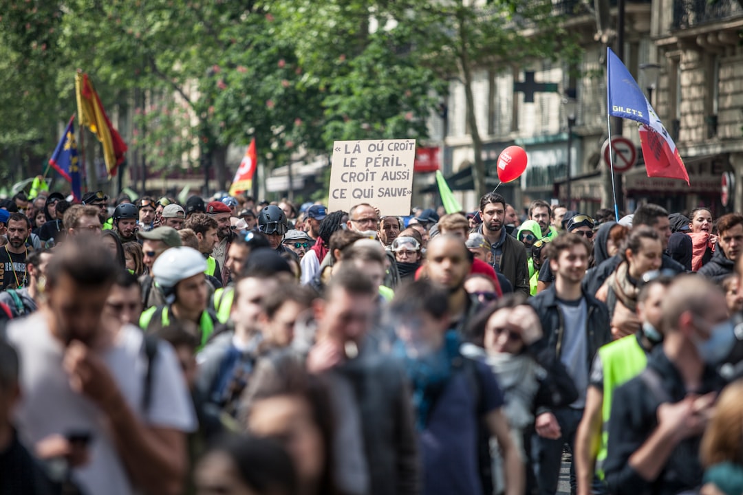 crowd walking near buildings during daytime