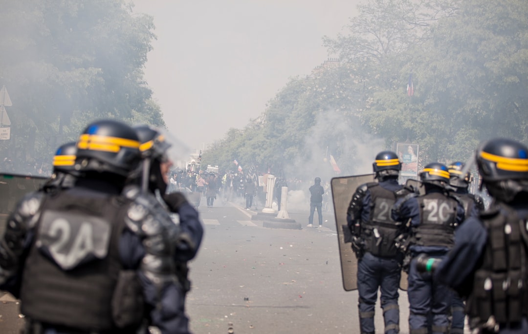 policemen holding shields during rally