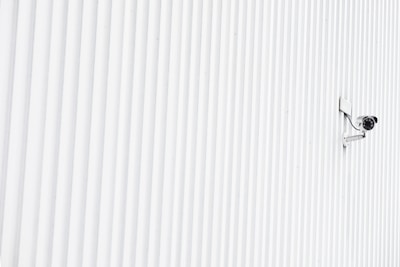 Security camera mounted in a common hallway ensuring safety.