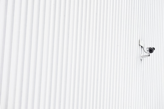 A modern London home with discreetly installed security cameras and alarm sensors.