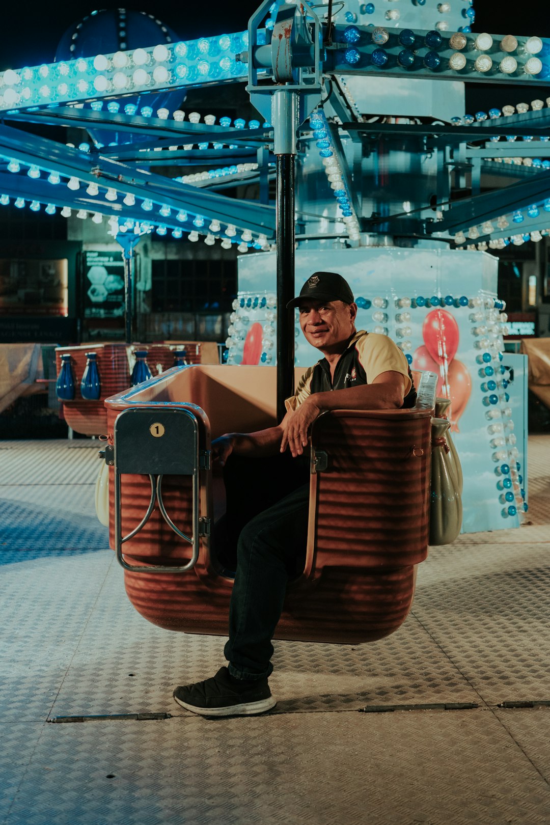 man riding circus ride