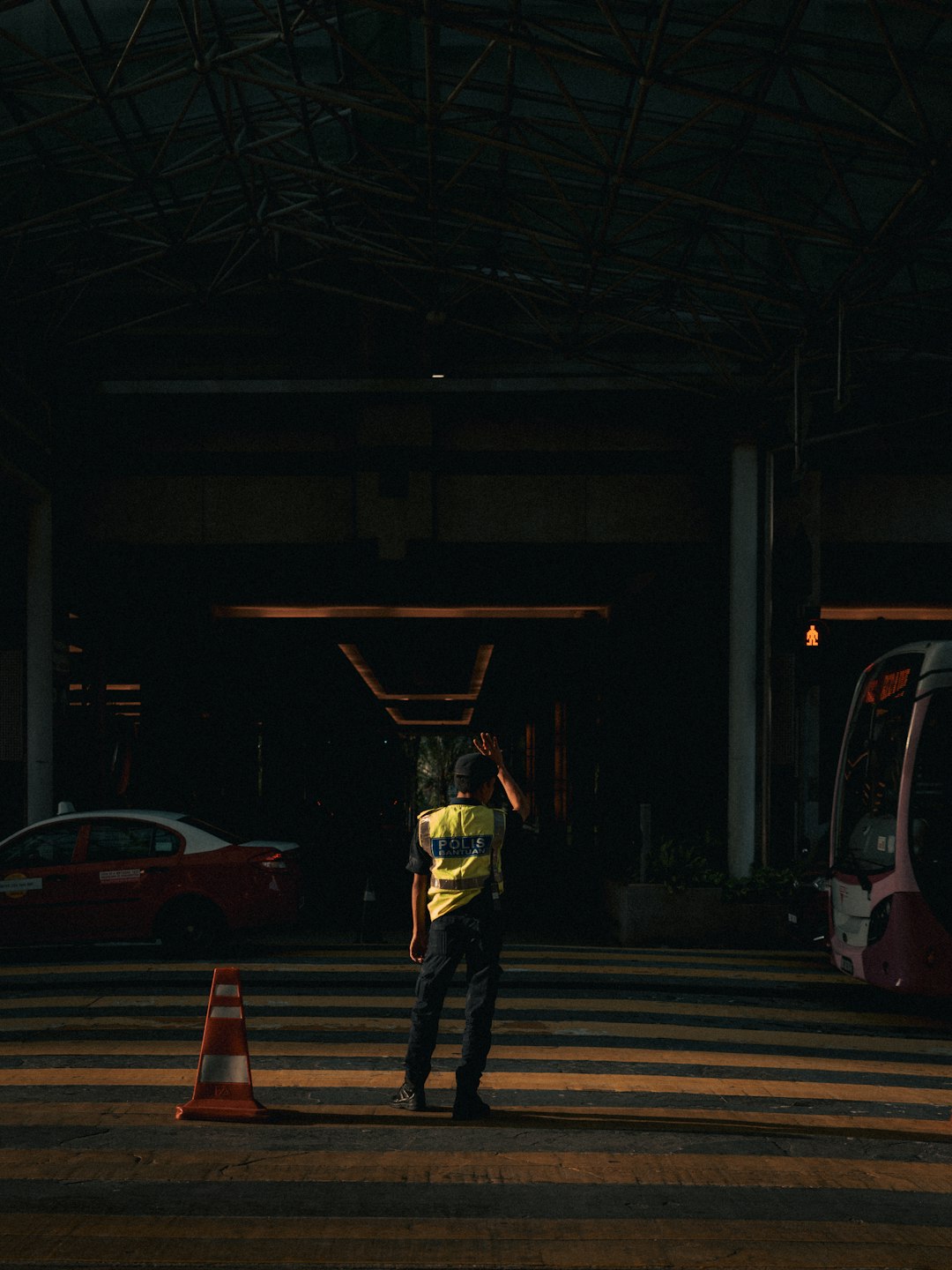 man standing on road